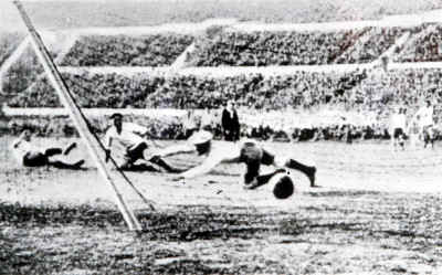 Argentine goalkeeper Juan Botassodives in vain in an attempt to stop Uruguay's second goal of the Final, scored by Cea.