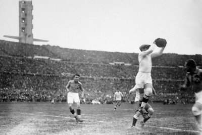 Yugoslavian goalkeeper Milovan Jaksic safely catches the ball during the semi-final between Uruguay and Yugoslavia.