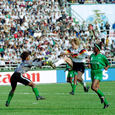 Nigeria goalkeepr Oyeka Anna Agumanu and Omon-Love Branch (5) try to stop German Heidi Mohr's attack.