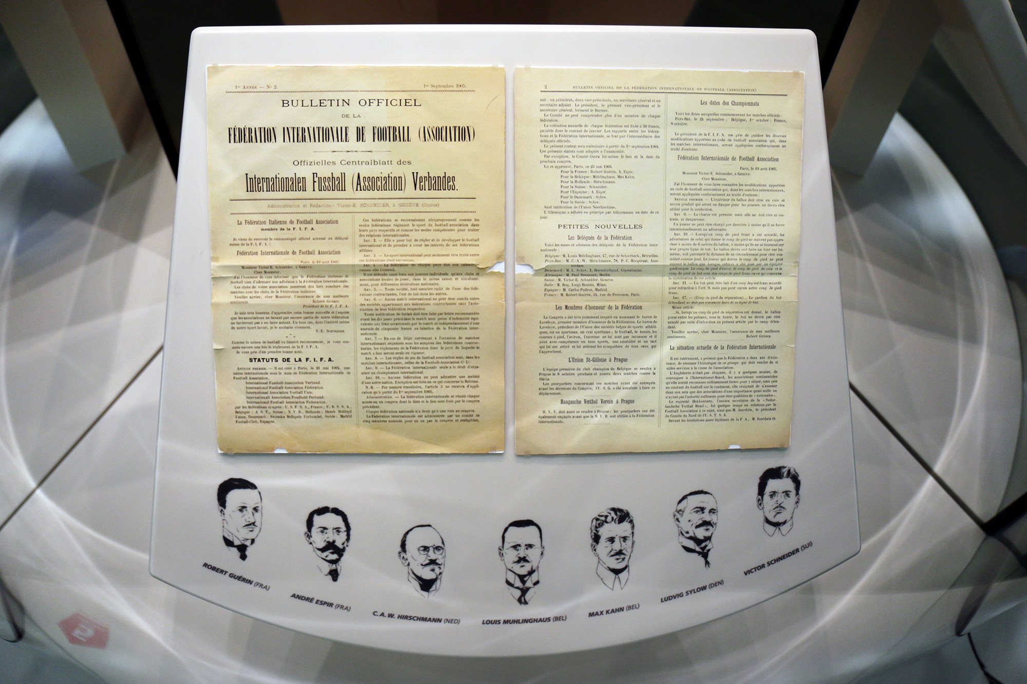 The second edition of the official FIFA Bulletin and drawings of the seven FIFA founders in the exhibition of the FIFA Museum.