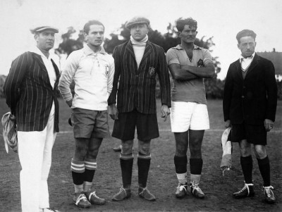 Referee Anibal Tejeda (centre) and linesmen Ricardo Vallarino and Mr Baldway line up with the captains of Brazil, Jao Coelho Neto (also known as Preguinho) and Milutin Ivkovic of Yugoslavia prior to their match at the Parque Central in Montevideo.