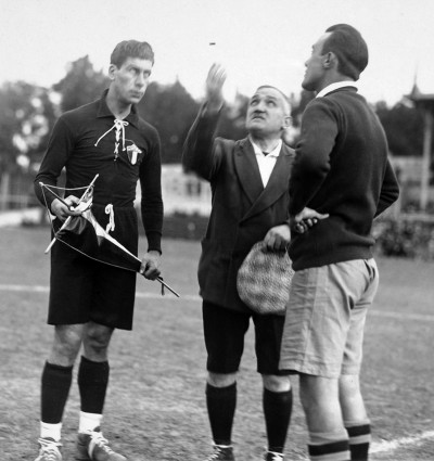 Referee Henry Cristophe tossing the coin watched by Mexican captain Rafael Gutierrez (left) and Chile's Carlos Schenerberger.