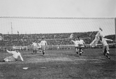 Argentinian goalkeeper Juan Botasso (left) is beaten, and defender Juan Evaristo (right) can't clear the ball off the line as Pablo Dorado's (not in picture) shot gives Uruguay an early lead.