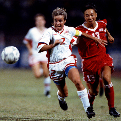 Denmark's Karina Sefron (left) under pressure of China's Niu Lijie during the group match.